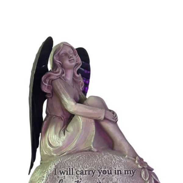 Angel figurine with memorial text on a stone-like base