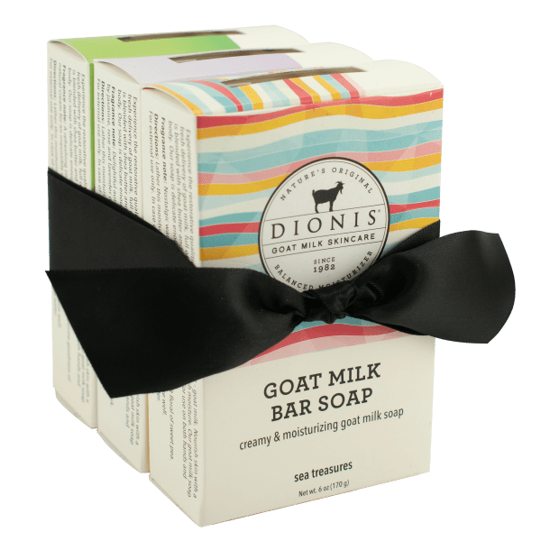 Three boxed bars of goat milk soap tied with a black ribbon