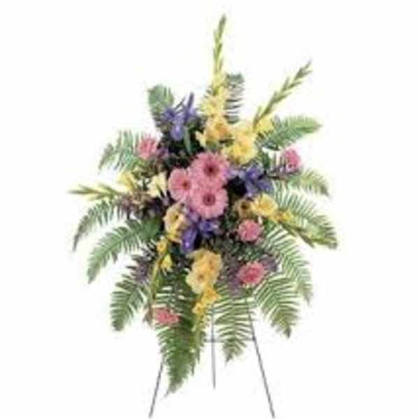 Standing floral spray with pink, yellow, and purple flowers