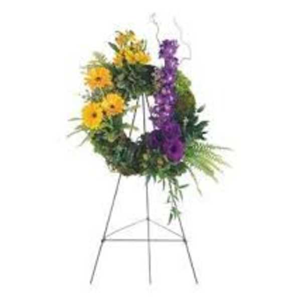 Floral wreath on a standing easel with yellow and purple flowers