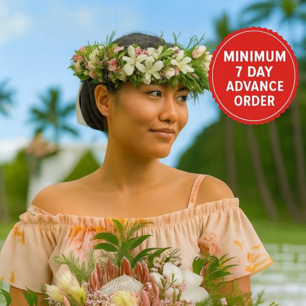 Woman wearing a floral crown and holding a large pink and white tropical bouquet outdoors