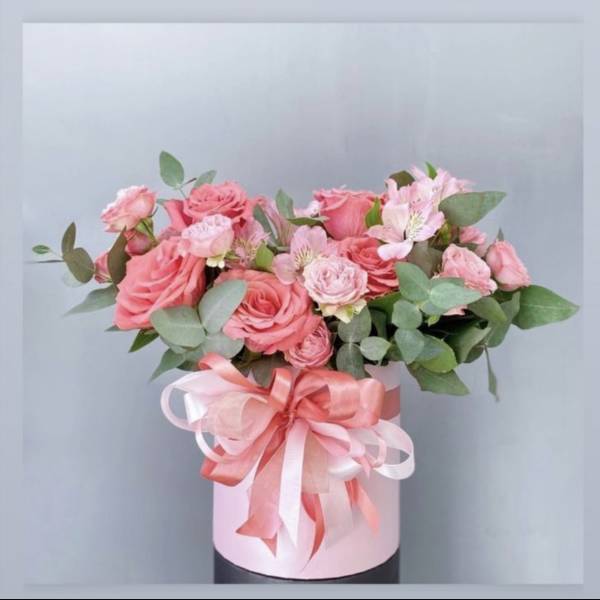 Pink rose bouquet in a pale pink box with a ribbon bow