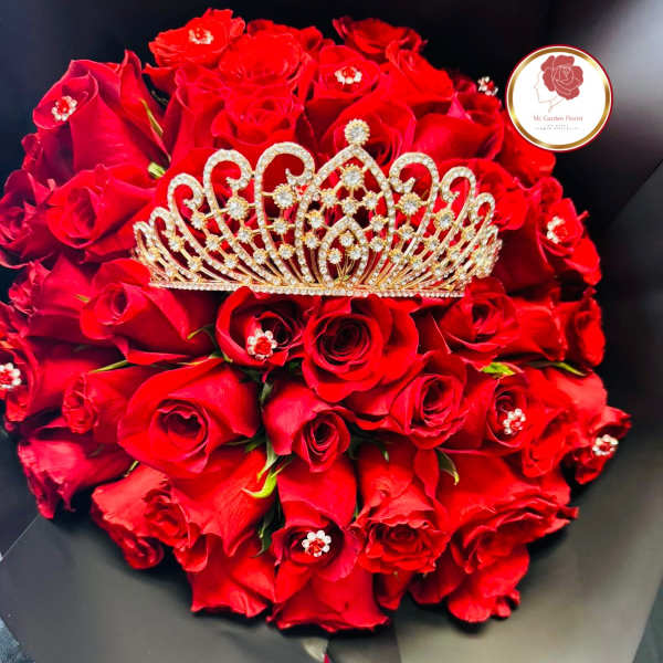Bouquet of red roses with a jeweled tiara on top