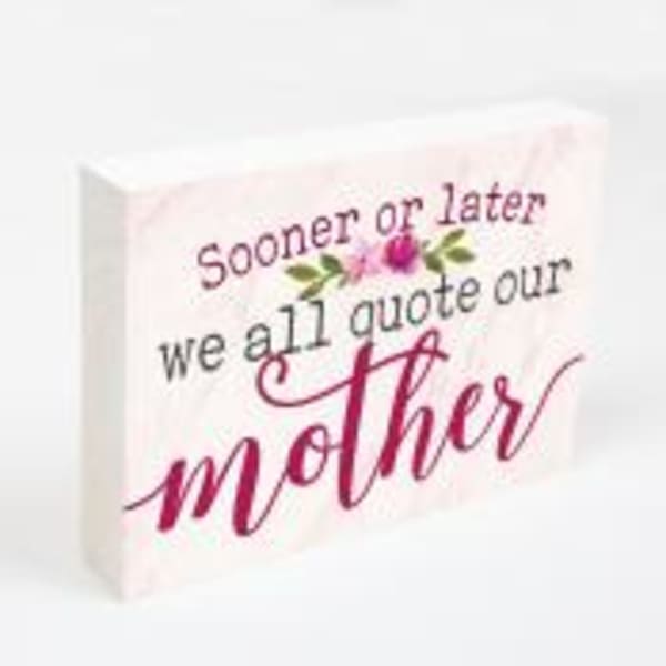 Decorative sign with the words "Sooner or later we all quote our mother"