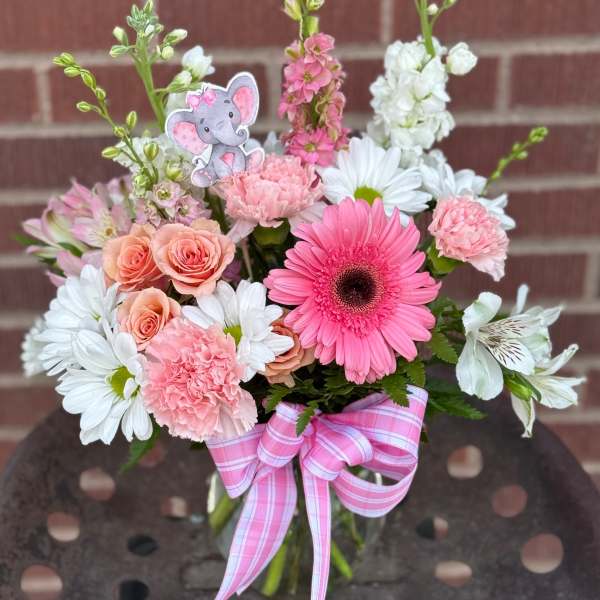 Pink and white mixed bouquet with a pink ribbon and elephant pick