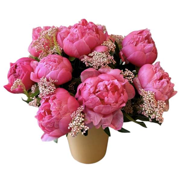 Pink peony bouquet in a tan vase