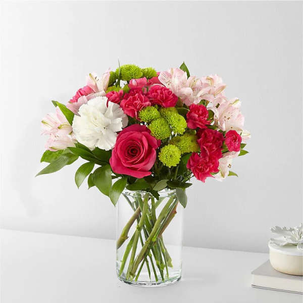 Pink and white mixed bouquet in a clear glass vase