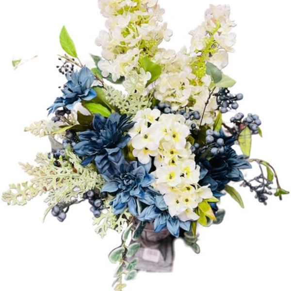 Blue and white floral arrangement in a vase