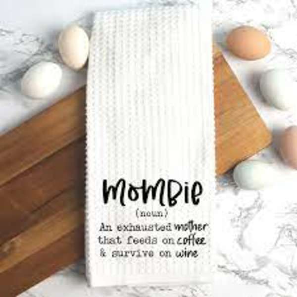 White towel with "Mombie" text surrounded by eggs