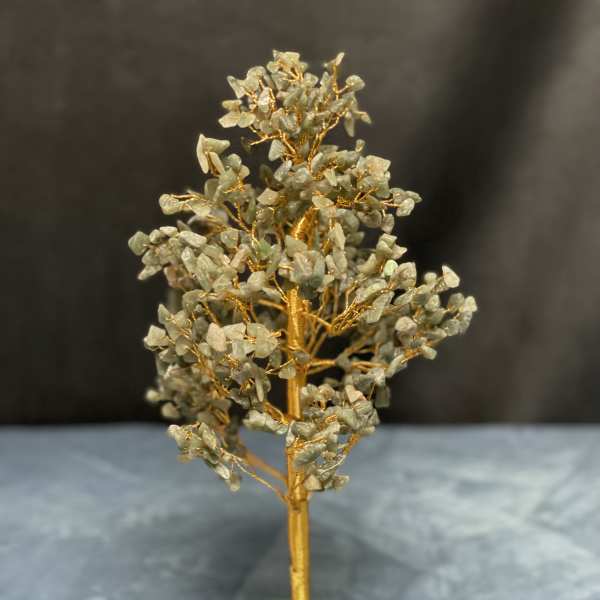 Gemstone tree sculpture with gold wire branches on a green stone base