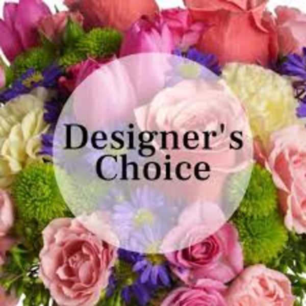 Mixed bouquet of pink, purple, and green flowers with a Designer's Choice label