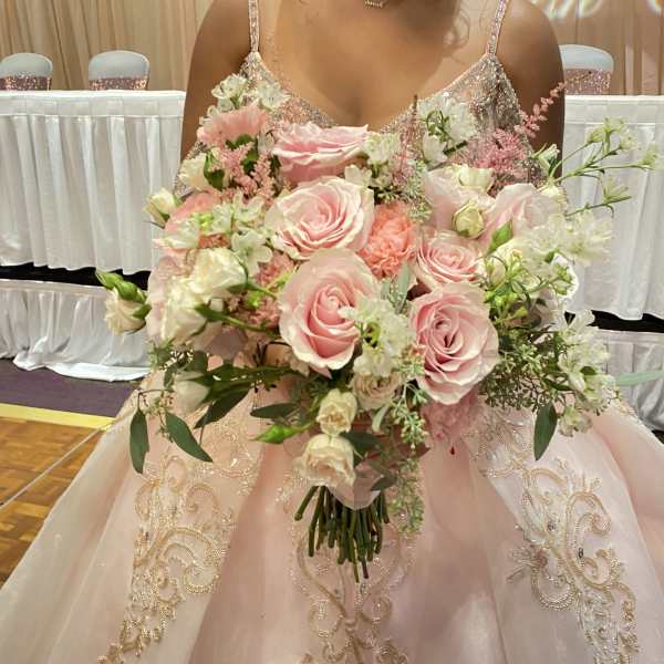 Bride holding a large pink and white bouquet