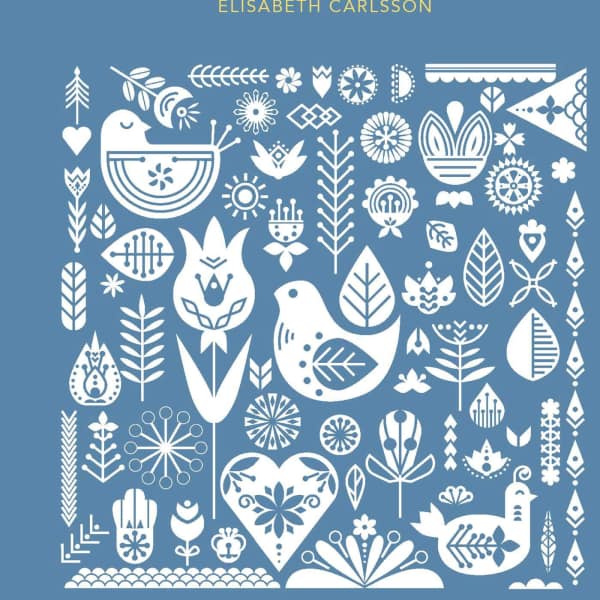 Blue book cover with white folk-art birds and floral motifs