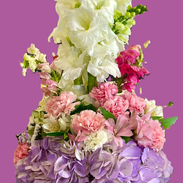Basket arrangement of white gladiolus, pink carnations, and lavender hydrangeas