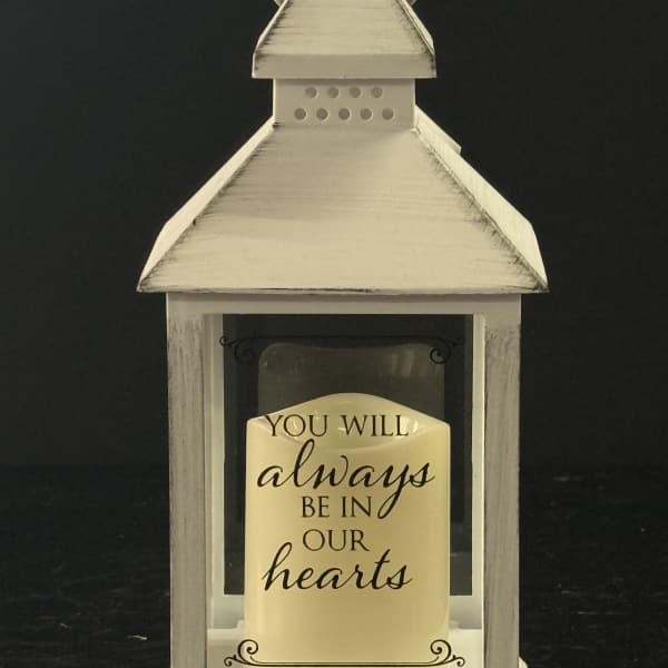 White lantern with a memorial message card inside