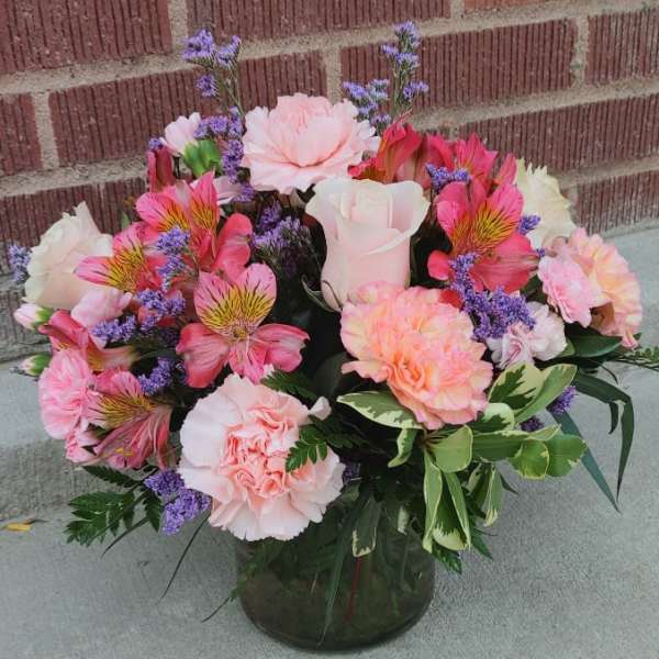 Pink and white mixed bouquet in a glass vase