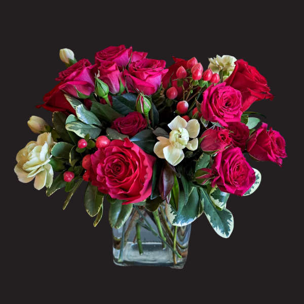Pink and red rose bouquet in a clear glass vase