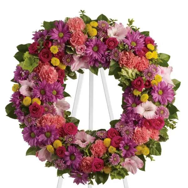 Colorful floral wreath on a white easel