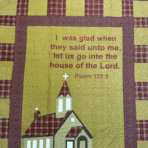 Quilted wall hanging with a church and Psalm 122:1 text