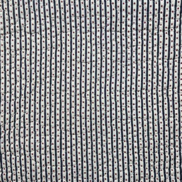 Quilted fabric with navy stripes and small red stars
