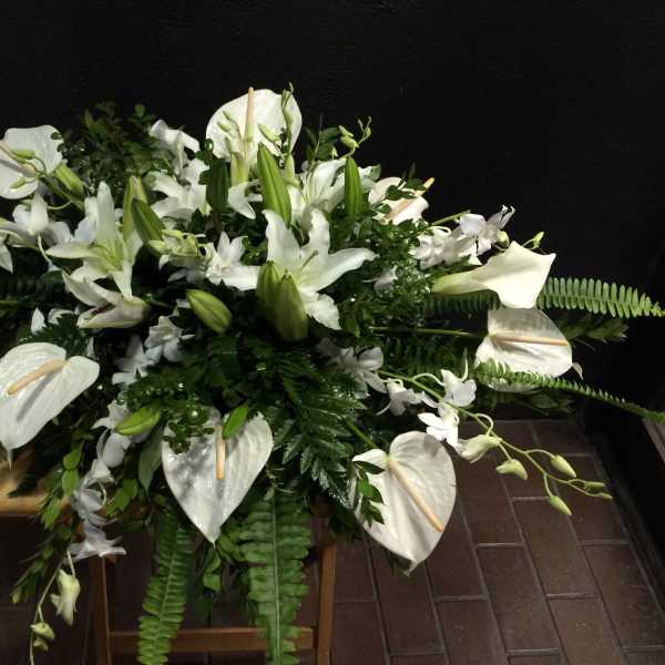 Casket white floral arrangement