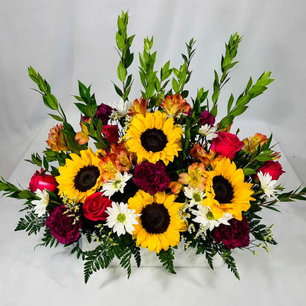 Mixed bouquet with sunflowers, roses, and white daisies