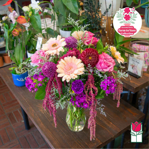 Mixed pink and purple bouquet in a clear glass vase