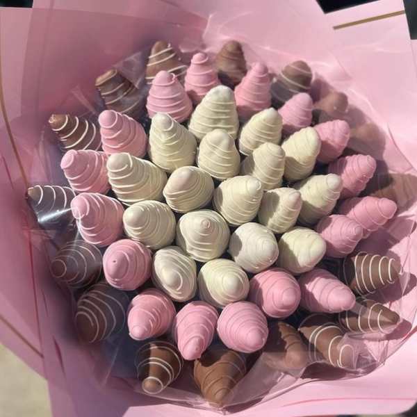 Bouquet of pink, white, and brown chocolate treats wrapped in pink paper
