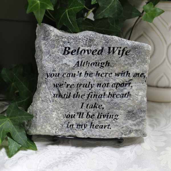Engraved memorial stone with ivy leaves and a sympathy message