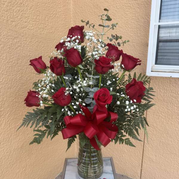 One Doz Red Roses in an arrangement