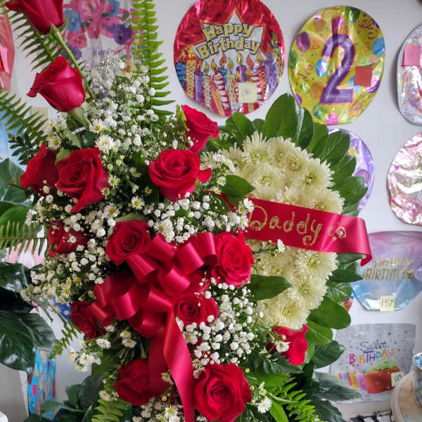 Large red rose and white chrysanthemum arrangement with a birthday ribbon