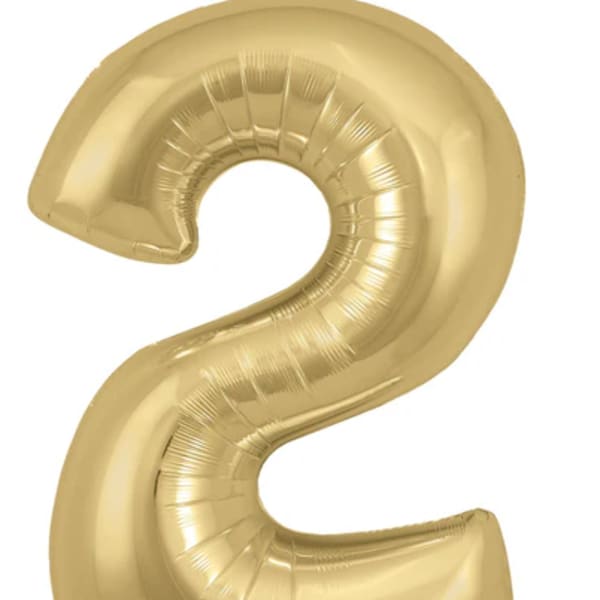 Gold foil balloon shaped like the number 2