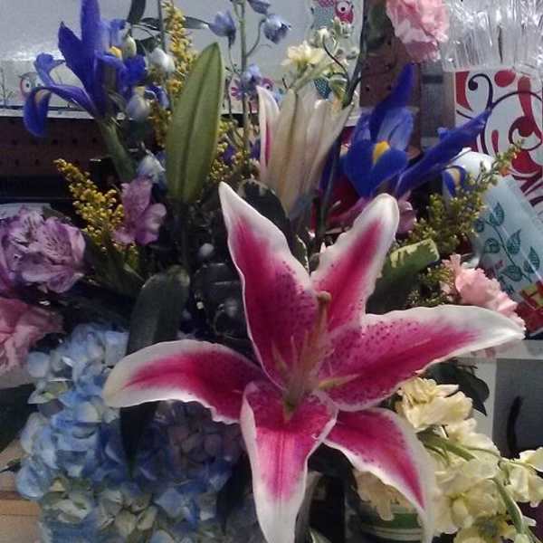 Pink stargazer lily bouquet in a clear glass vase