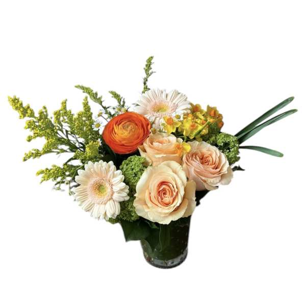 Mixed bouquet of roses, gerbera daisies, and yellow filler flowers in a glass vase