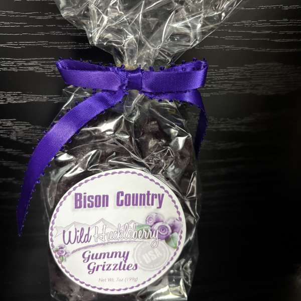 Bag of wild huckleberry gummy candies tied with a purple ribbon