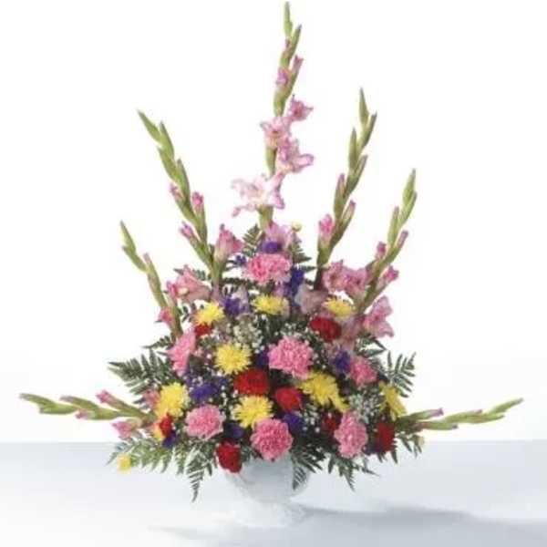 Colorful mixed flower arrangement in a white vase