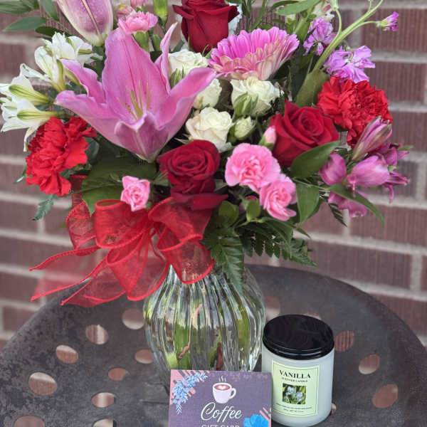 Mixed bouquet in a glass vase with a coffee gift card and vanilla candle