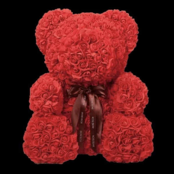 Red rose teddy bear with a ribbon bow