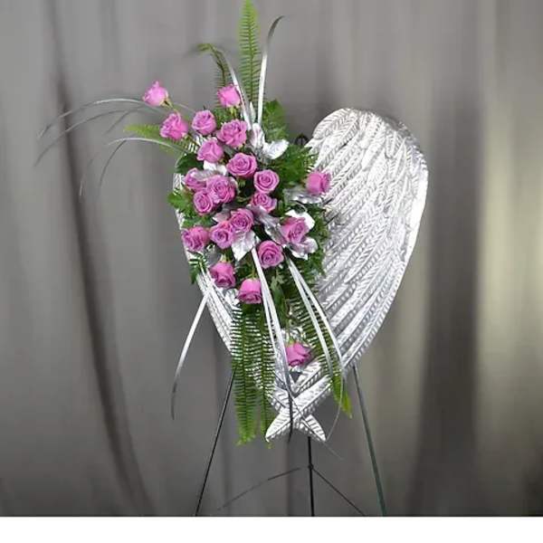 Pink rose spray on a silver heart-shaped stand