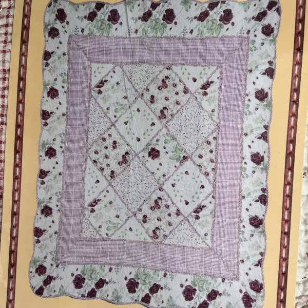 Floral patchwork quilt with pink and burgundy rose prints