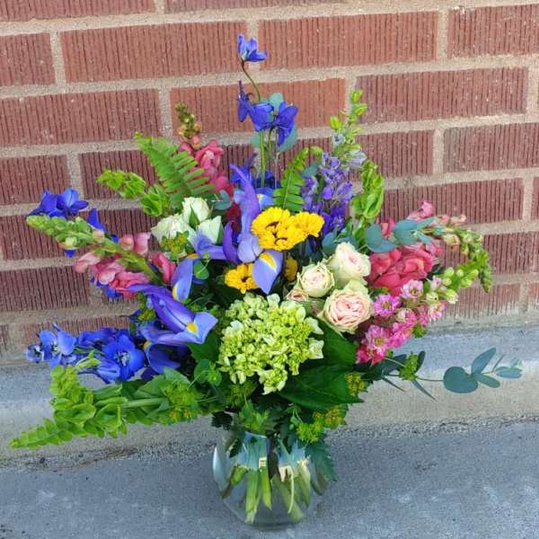 Colorful mixed bouquet in a clear glass vase