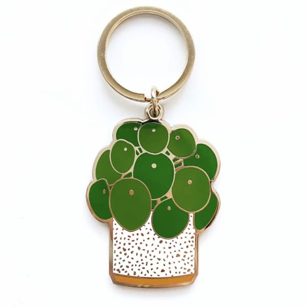 Potted plant keychain with green leaves and a gold ring