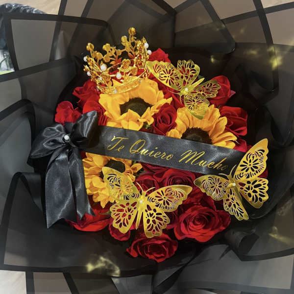 Bouquet of red roses and sunflowers with black wrapping and gold butterfly accents