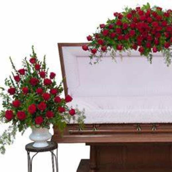 Red rose funeral casket spray with matching side arrangements