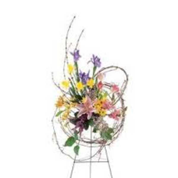 Colorful mixed flower arrangement on a metal easel