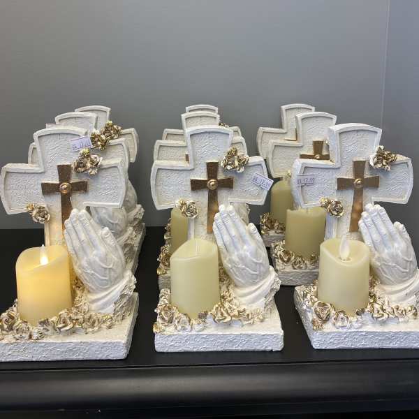 Decorative cross candle holders with praying hands and faux candles