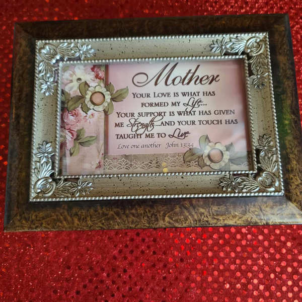 Decorative framed Mother plaque with floral accents on a red textured background
