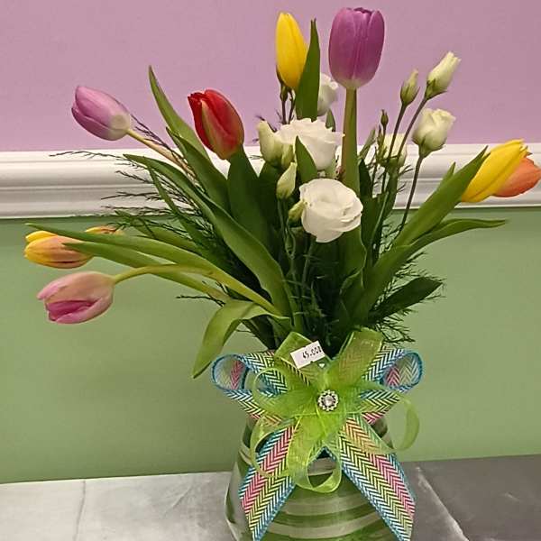 Elegant mixed color tulip arrangement with spray rose.