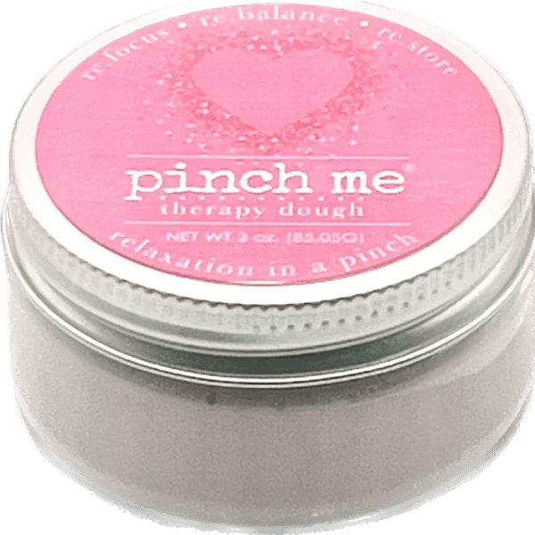 Pink jar of therapy dough with a heart label