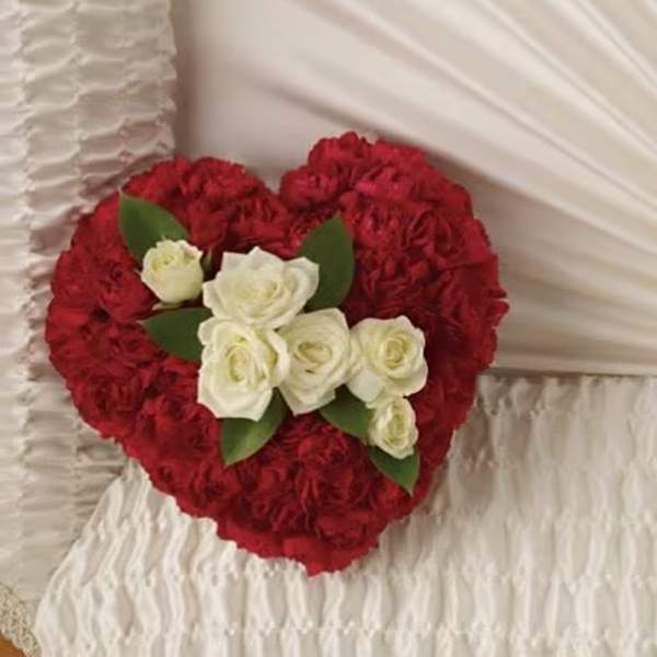 Heart-shaped red carnation arrangement with white roses